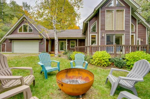 a yard with chairs and a fire pit in front of a house at Spacious Dover Refuge about 5 Mi to Mount Snow! in Dover
