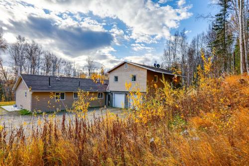 a house in the middle of a field at Convenient Fairbanks Guest Suite with Grill! in Fairbanks