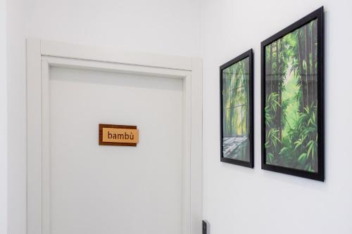 a sign on a door with three pictures on it at Green Garden in Rome
