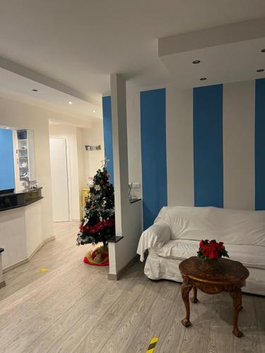 a bedroom with a christmas tree and a bed at Bike Hotel Oasi in Finale Ligure