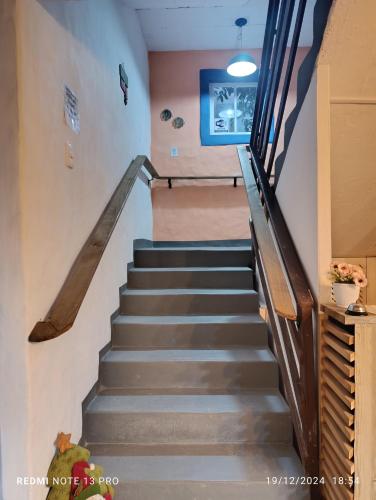 a stairway in a home with a stair case at Residencial María in Bombinhas