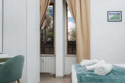 a bedroom with a bed and a window at Green Garden in Rome