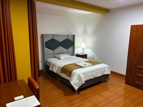 Postel nebo postele na pokoji v ubytování HOTEL LOS ANDES SUITE