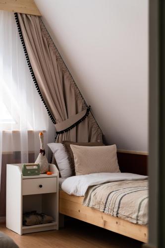 a bedroom with a bed with a canopy at Panocek i Babka in Białka Tatrzanska