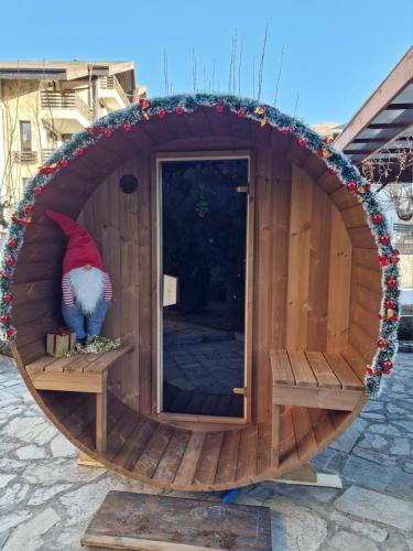 a large wooden dog house with a cat in it at Aspen Suites Luxury Studio A006 in Razlog
