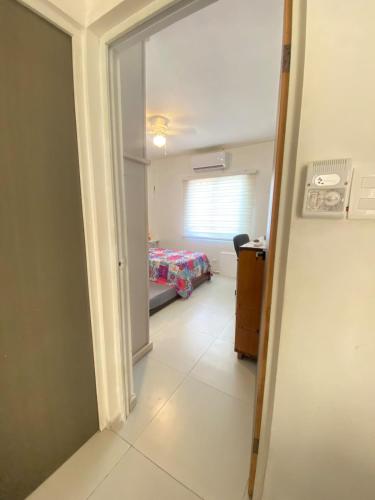 Кровать или кровати в номере Ground floor apartment, CAS, Centenario, Cons