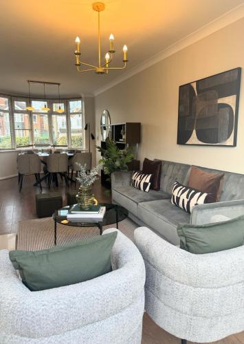 a living room with a couch and chairs and a table at Spacious house for 7 - Ideal for Solihull NEC - Work and Family Groups in Birmingham