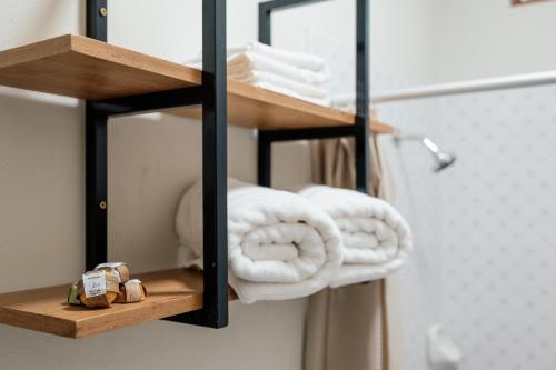 a towel rack with towels on it in a bathroom at Taki Tambo Lodge in Tarapoto