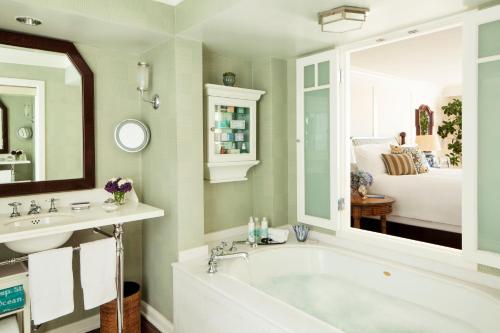 a living room filled with furniture and a tub at Shutters On The Beach in Los Angeles