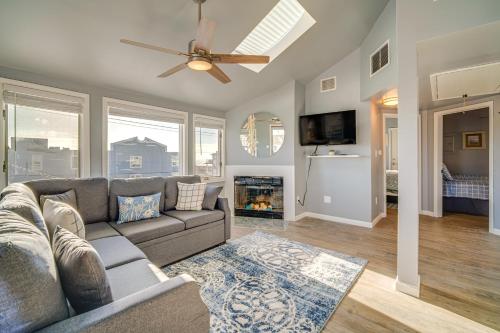 a living room with a couch and a fireplace at Renovated Ocean City Retreat - Walk to Beach! in Ocean City