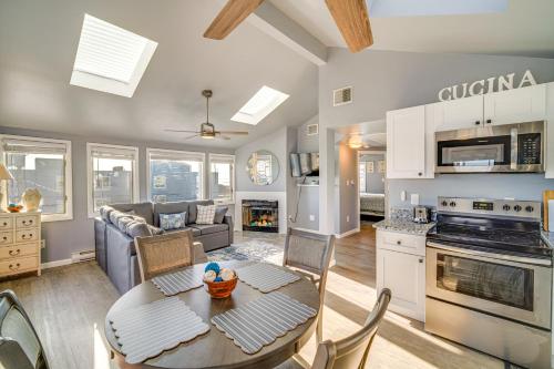 a kitchen and living room with a table and chairs at Renovated Ocean City Retreat - Walk to Beach! in Ocean City