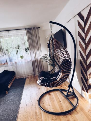 a room with a swing in a living room at GóralSki in Wisła