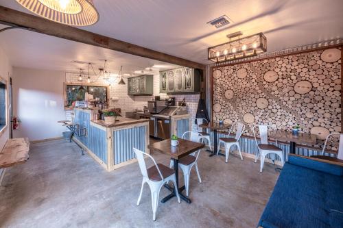a kitchen and dining room with tables and chairs at Pend Oreille Shores Resort in Hope