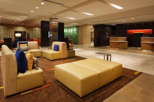 a lobby with couches and chairs in a hotel at Courtyard by Marriott San Angelo in San Angelo