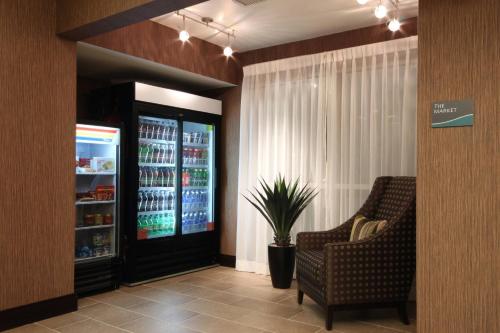 a waiting room with two chairs and a drink cooler at Fairfield Inn & Suites by Marriott Amarillo Airport in Amarillo
