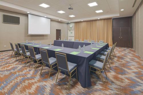 a large conference room with a long table and chairs at Courtyard by Marriott Saltillo in Saltillo