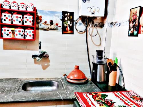 a kitchen with a sink and a counter top at Luxury 3-bedroom apartments 5-min to the Airport in Fès