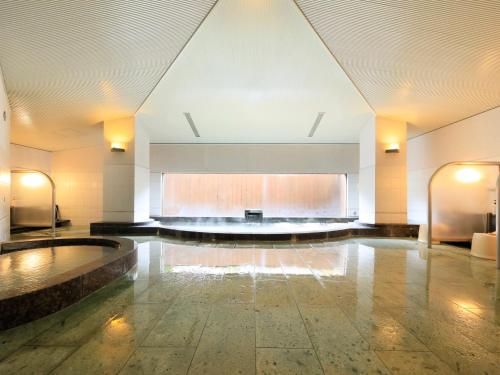 a large room with a stage in the middle of it at Villa The Club 御殿場ウエスト in Gotemba