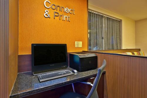 a desk with a laptop computer and a printer at Fairfield by Marriott Southeast Hammond, IN in Hammond