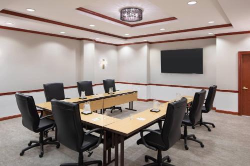 a conference room with a long table and chairs at Courtyard by Marriott Stamford Downtown in Stamford