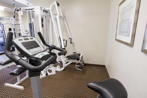 a gym with a treadmill and tread machines at Scottsdale Parkview in Scottsdale