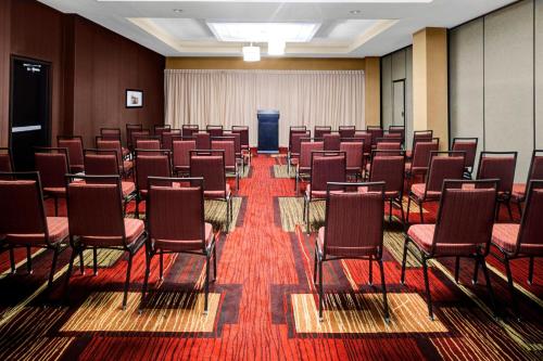a conference room with chairs and a podium in it at Courtyard by Marriott St. Cloud in Saint Cloud