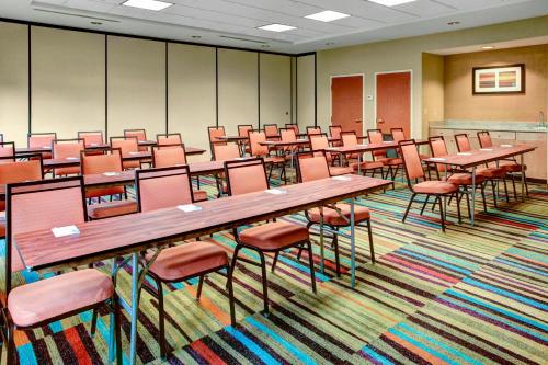 a large room with tables and chairs in it at Fairfield Inn & Suites by Marriott Atlanta Stonecrest in Lithonia