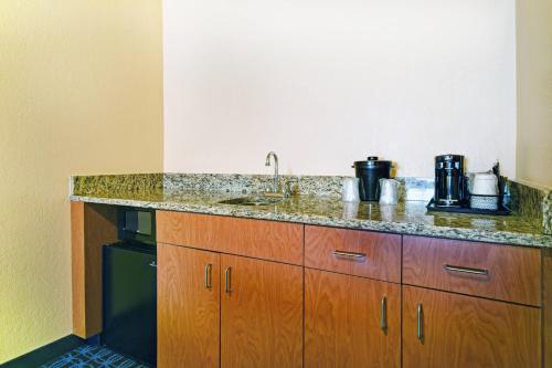 a kitchen with a sink and a counter top at Fairfield Inn & Suites by Marriott Atlanta Vinings/Galleria in Atlanta