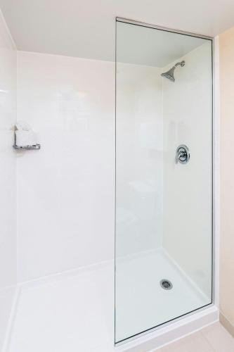 a shower with a glass door in a bathroom at Fairfield Inn & Suites by Marriott Atlanta Perimeter Center in Atlanta