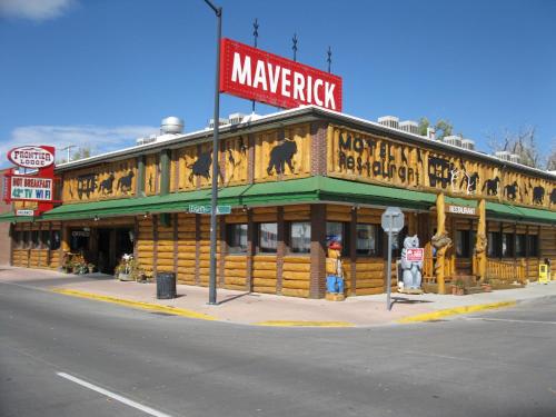 a large wooden building with a monkey sign on it at Frontier Lodge in Lander