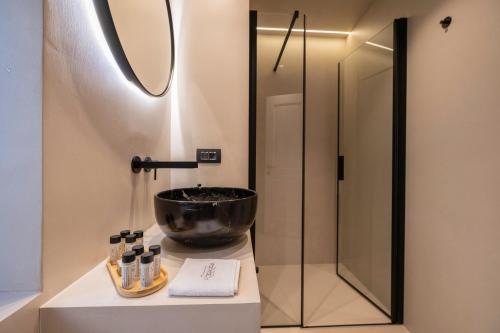 a bathroom with a bowl sink and a mirror at Forkira Luxury Hvar in Hvar