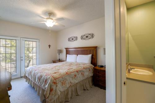 a bedroom with a bed and a sink at Legacy Villa 304 in Gulfport