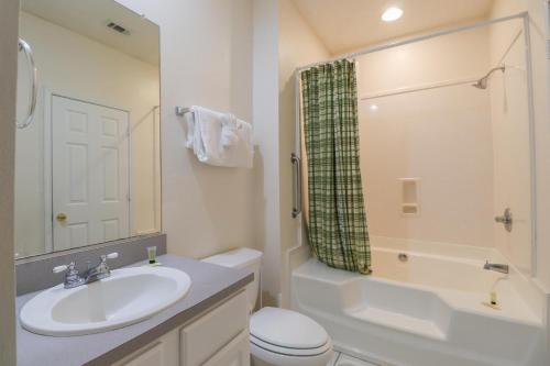 a bathroom with a sink and a toilet and a shower at Legacy Villa 304 in Gulfport
