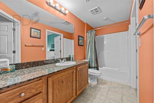 a bathroom with a sink and a toilet and a shower at Legacy Tower I 903 in Gulfport