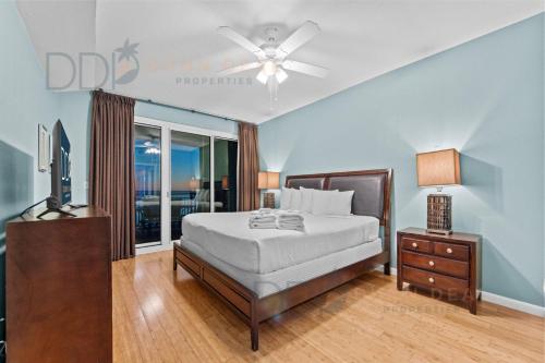 a bedroom with a bed and a ceiling fan at Legacy Tower I 903 in Gulfport