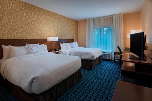 Кровать или кровати в номере Fairfield Inn & Suites by Marriott Atlanta Peachtree City