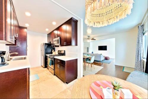 a kitchen and living room with a table and a dining room at Coastal Hideaway in San Diego