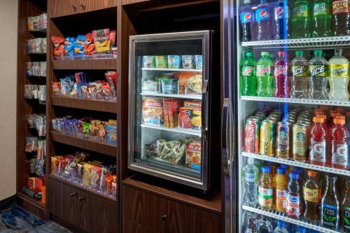 a refrigerator filled with lots of different types of drinks at Fairfield Inn by Marriott Kalamazoo West in Kalamazoo
