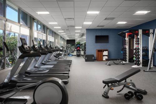 a gym with a row of treadms and machines at Courtyard by Marriott San Diego Mission Valley/Hotel Circle in San Diego