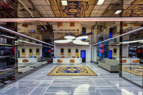 a large room with couches and a rug on the floor at Sunworld Dynasty Hotel Beijing Wangfujing in Beijing