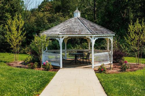 a gazebo with a table in a garden at Fairfield Inn & Suites Springfield Enfield in Springfield