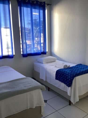 Ένα ή περισσότερα κρεβάτια σε δωμάτιο στο Hotel Faria