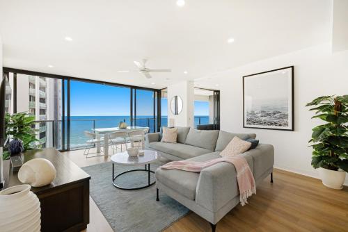 a living room with a couch and a table at Oracle Broadbeach Tower 1 Lvl 20 Free parking - GC Getaways in Gold Coast