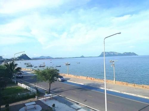 a view of a large body of water at Zea Zide Hotel in Prachuap Khiri Khan