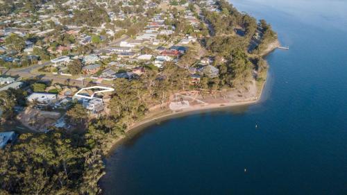 an aerial view of a small island in the water at Above Sunset in Paynesville