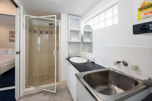 a bathroom with a sink and a shower at Broadwater view in southport 1b in Gold Coast