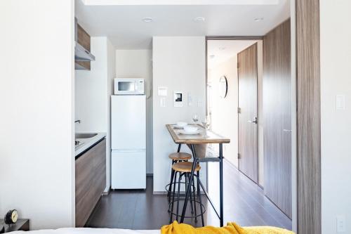 Η κουζίνα ή μικρή κουζίνα στο Dash Living Osaki