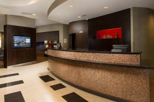 a lobby of a hotel with a reception counter at Courtyard by Marriott San Antonio SeaWorld/Lackland in San Antonio