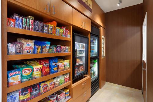 a walk in pantry with shelves filled with food at Fairfield Inn & Suites Bismarck North in Bismarck