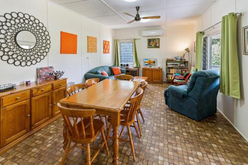 a living room with a wooden table and chairs at Kambera House in Raymond Island